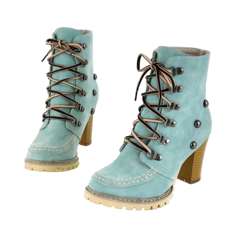 Pair of light blue boots with brown laces and buttons on a white background