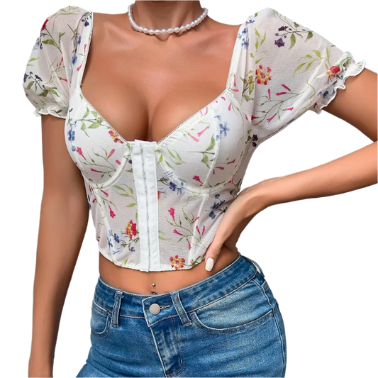 Floral print crop top with puff sleeves, paired with blue jeans, perfect for casual resort outings