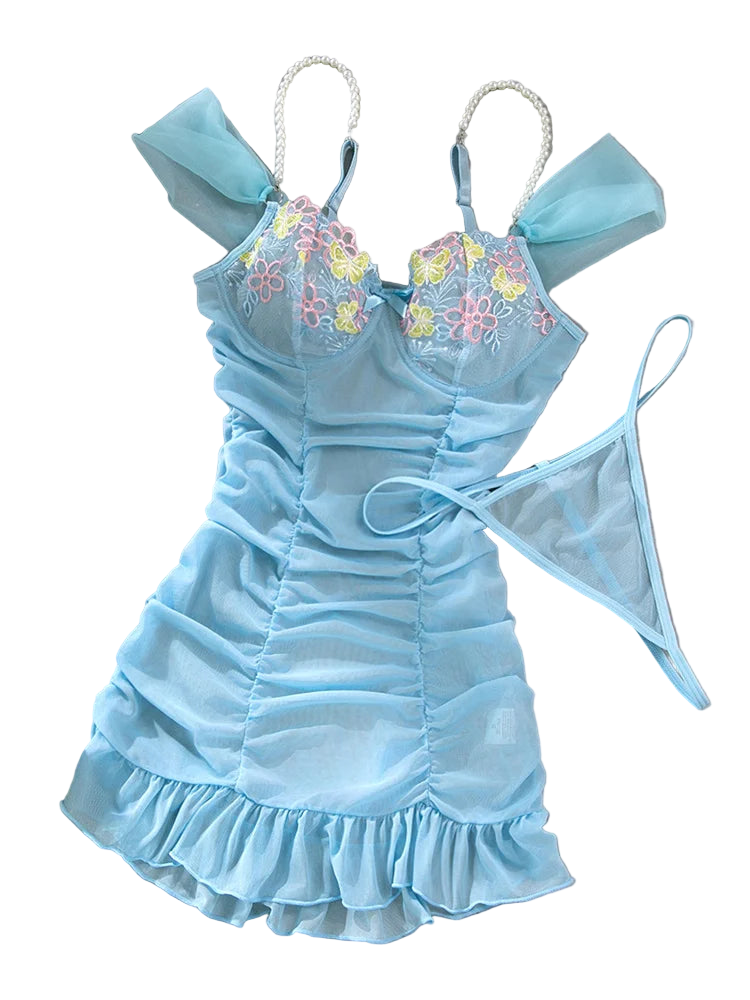 Light blue lingerie set with floral embroidery on a gray background