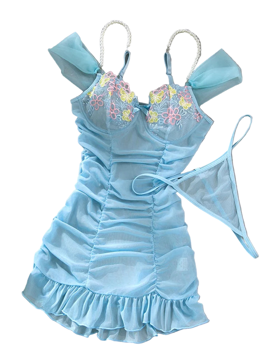 Light blue lingerie set with floral embroidery on a gray background