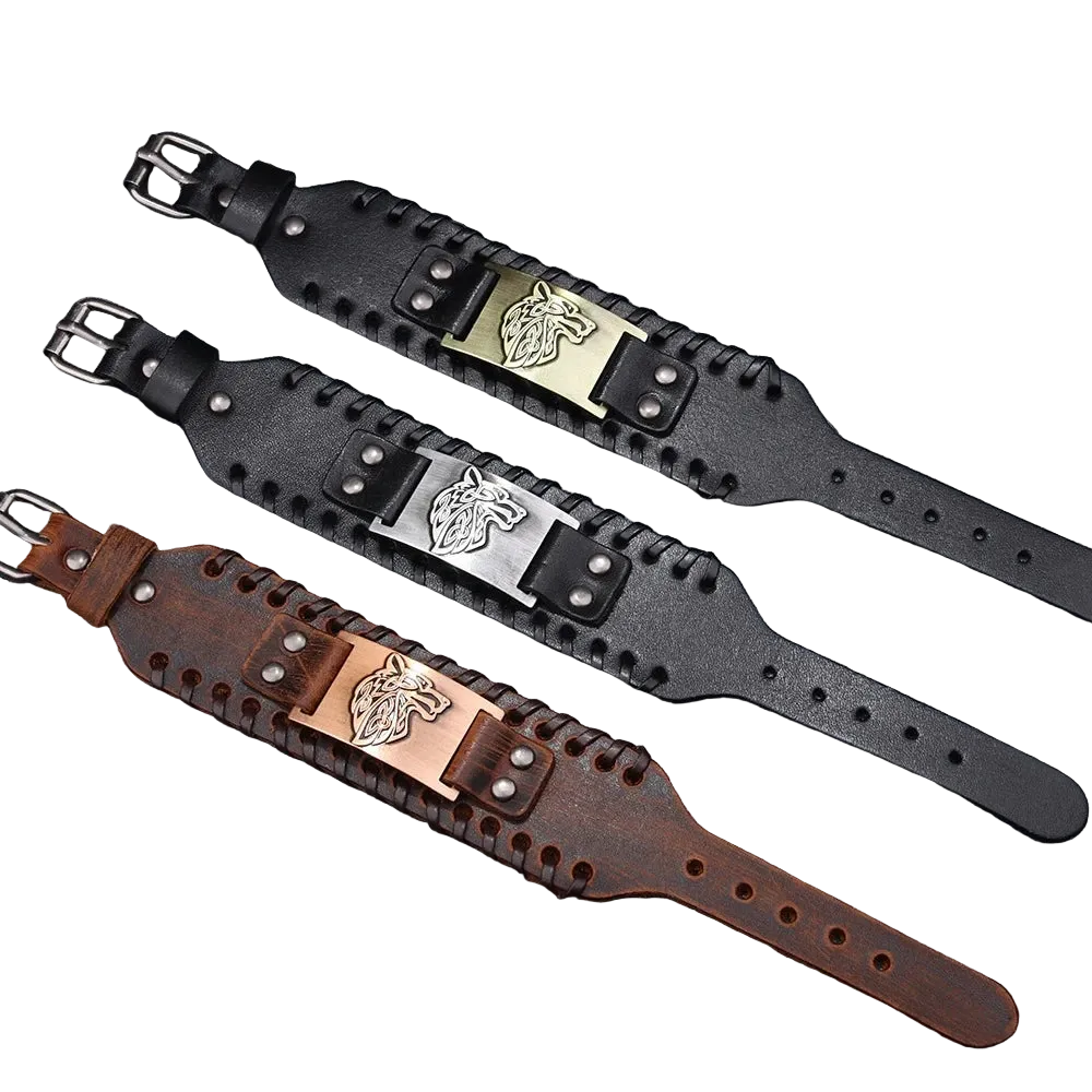 Three leather wristbands with metal buckles on a textured surface.