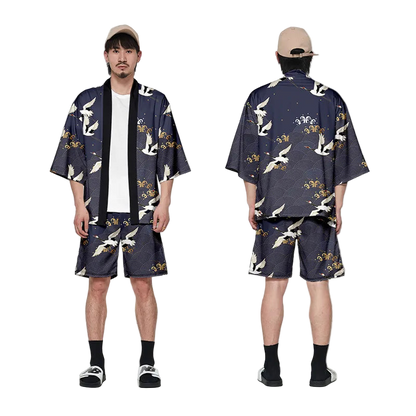 Person wearing a navy blue kimono-style outfit with white bird patterns, front and back views.