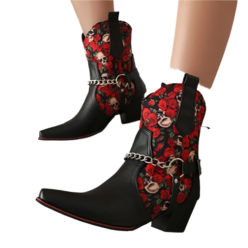 Black cowboy boots with red floral pattern and chain details on a light background