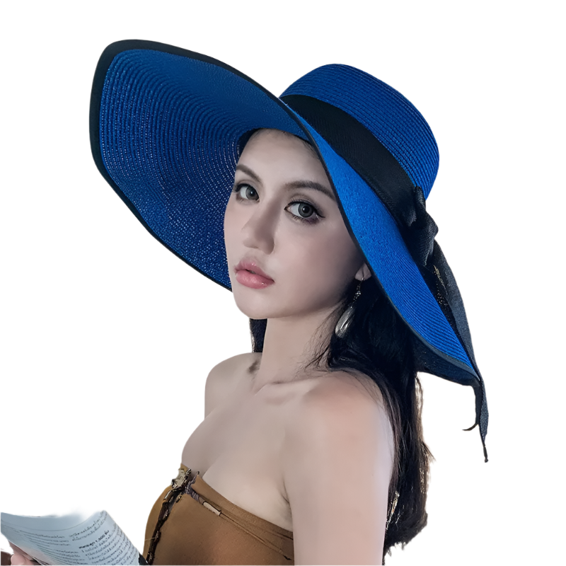 Woman wearing a blue hat indoors with a neutral background