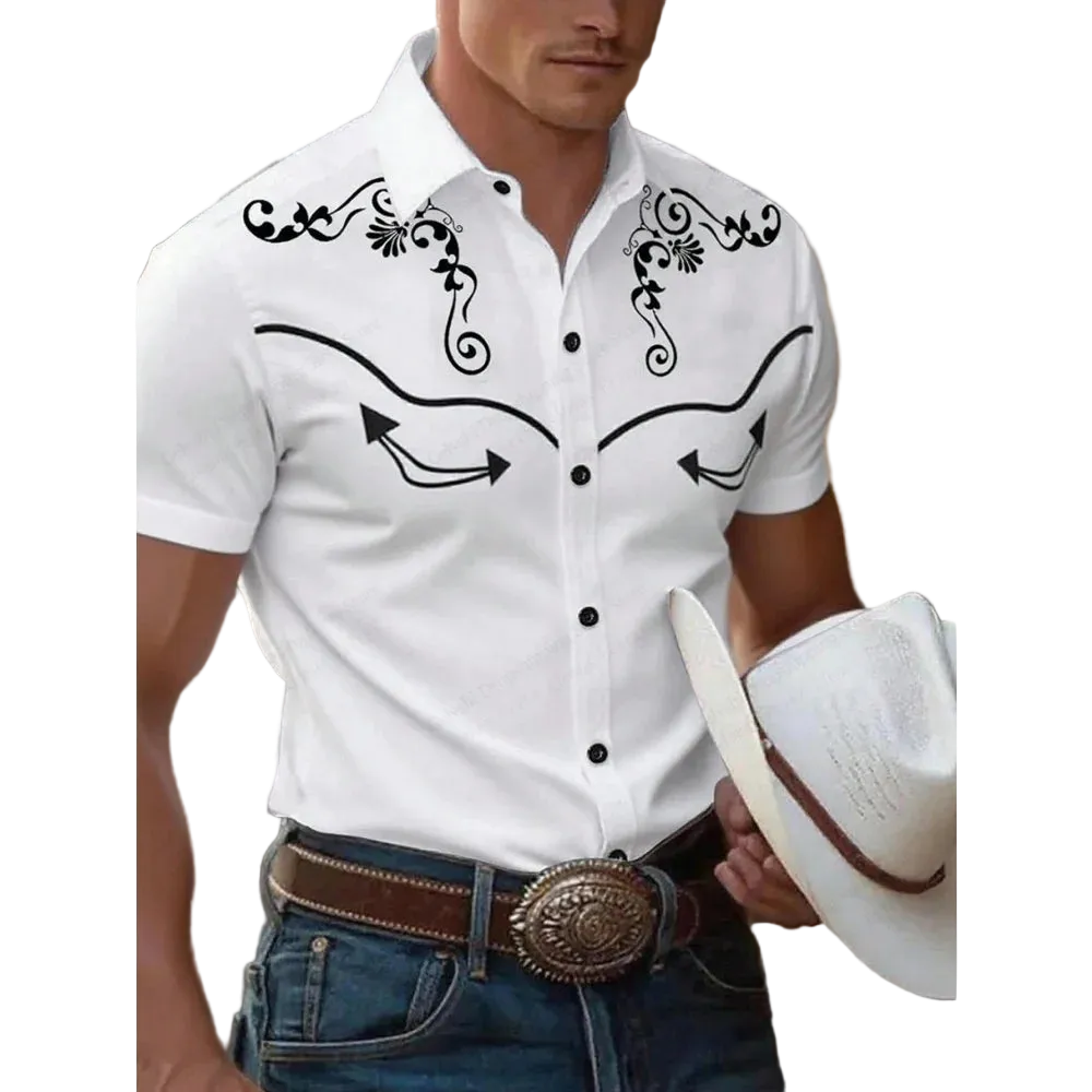 A man wearing a white short-sleeve western-style button-up shirt with black embroidered scrollwork and arrow details on the chest, paired with blue jeans and a brown belt, while holding a white cowboy hat.