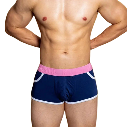 Navy swim shorts with pink waistband and white trim on a plain background