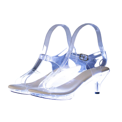 Clear high-heeled shoes with measurements on a reflective surface
