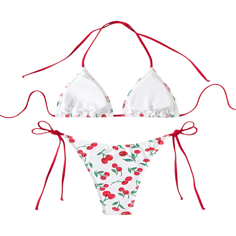 A white bikini with a cherry print. It features a classic triangle top and tie-side bottoms with red strings, giving it a playful and fruity look.
