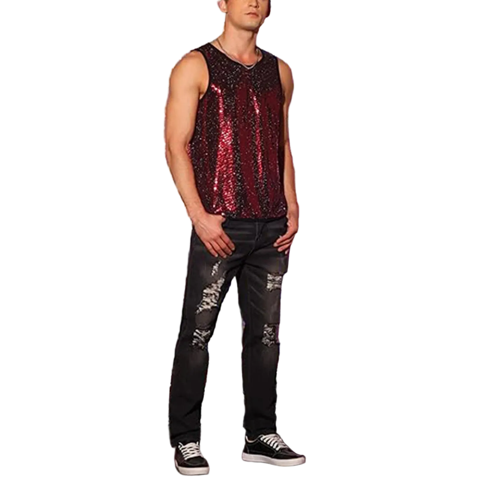 A man wearing a sleeveless sequined top with a red-to-purple gradient and black distressed jeans, standing in front of a purple tinsel curtain backdrop.
