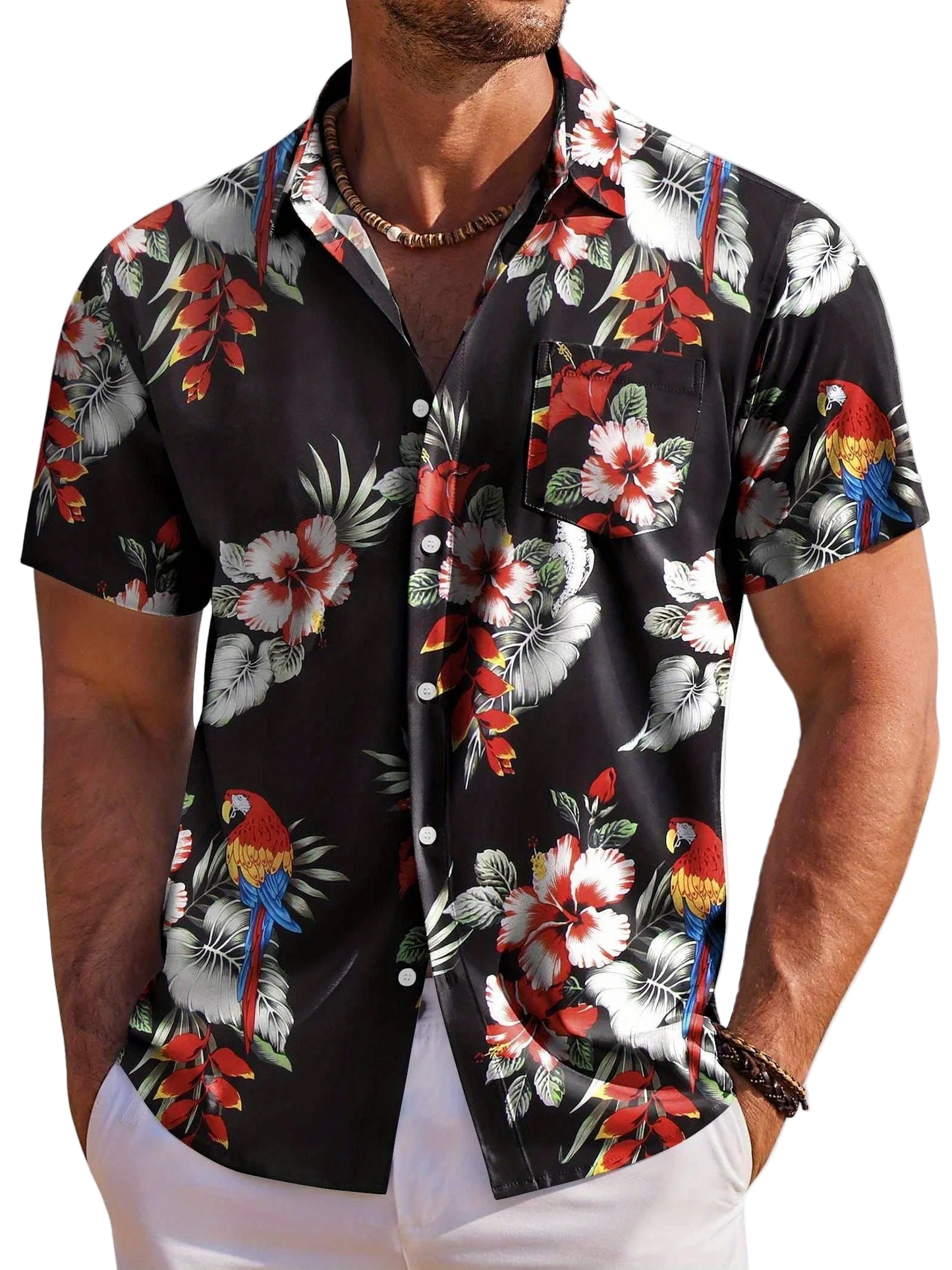 Man wearing a black floral and parrot patterned shirt on a white background