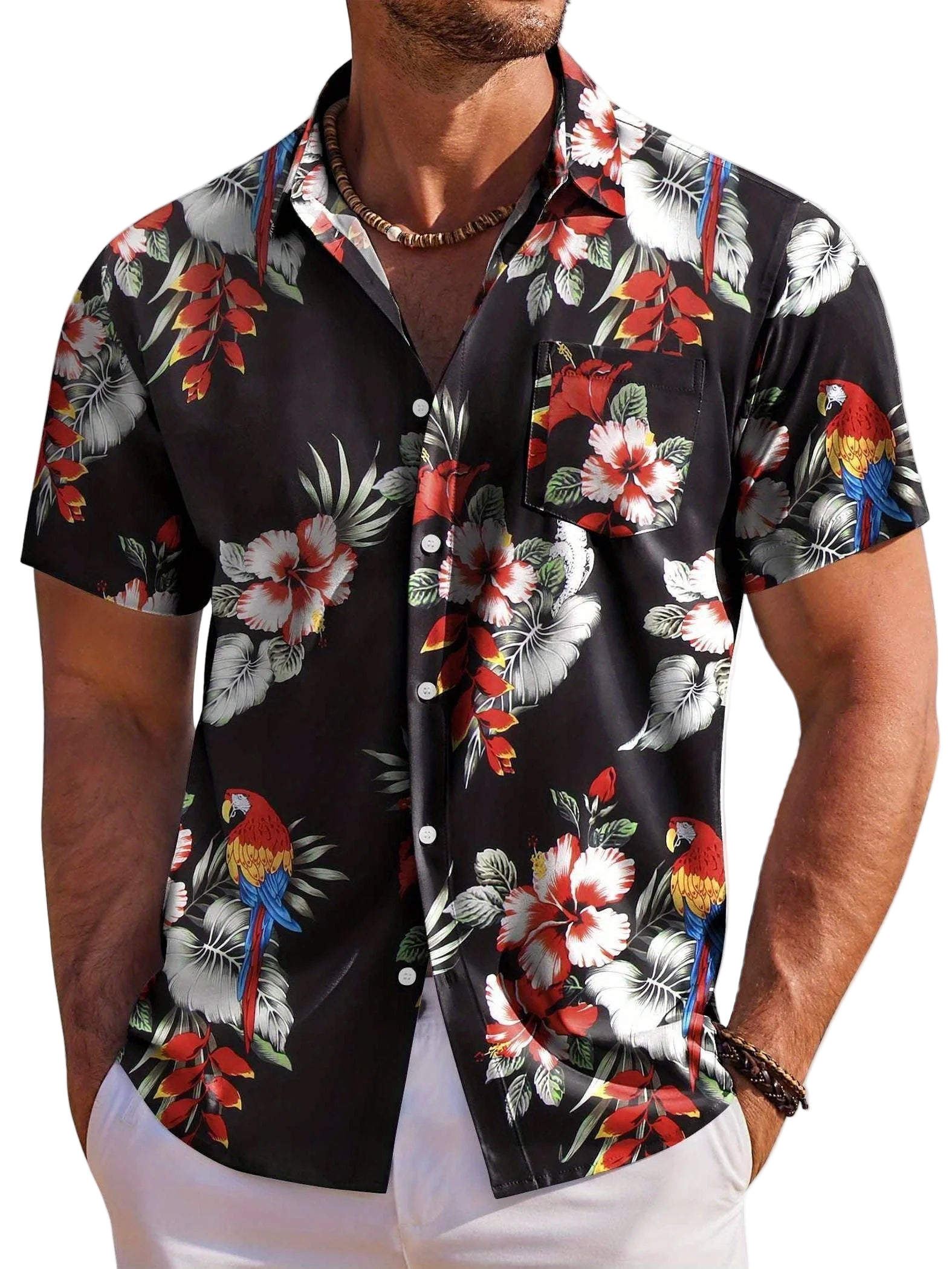 Man wearing a black floral and parrot patterned shirt on a white background