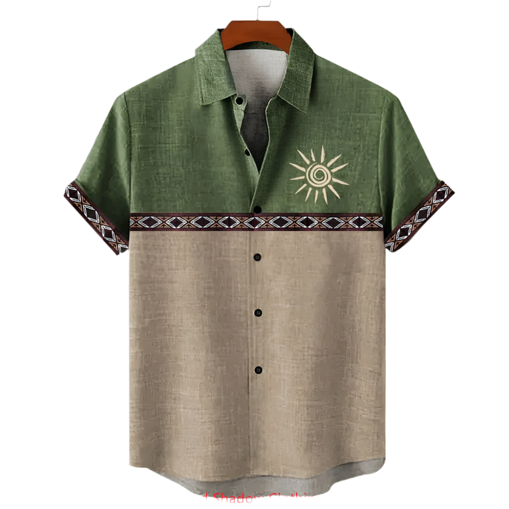 Green and beige shirt with sun design on a hanger against a white background