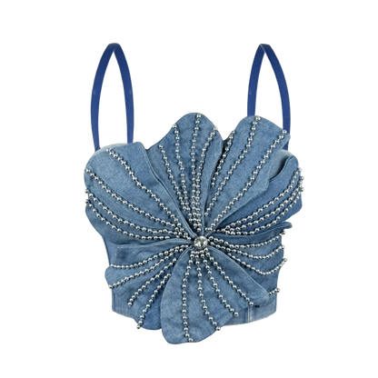 A light blue denim flower-shaped shoulder bag with silver beaded radial details and blue shoulder straps, shown against a plain white background.