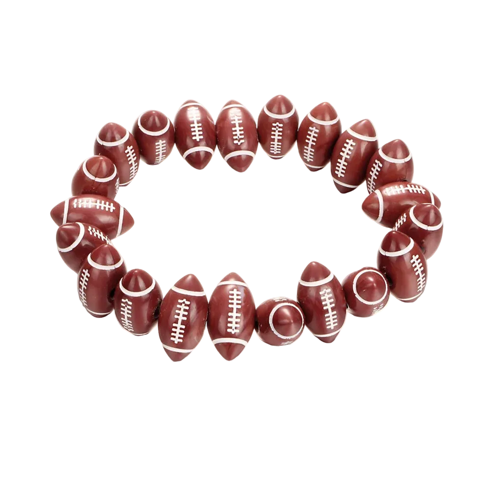 A beaded stretch bracelet made of football-shaped beads in a dark reddish-brown color with white laces, displayed on a clean white background.