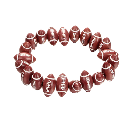 A beaded stretch bracelet made of football-shaped beads in a dark reddish-brown color with white laces, displayed on a clean white background.