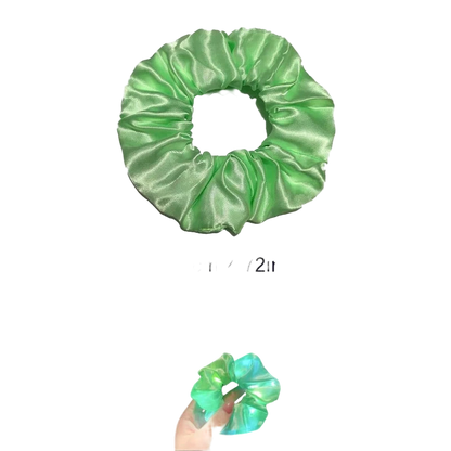Green satin scrunchie with size measurement and additional images of it glowing in dark settings.