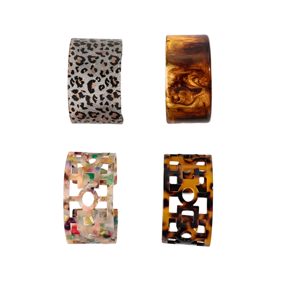 Bold leopard print wide cuff bangle featuring hollow geometric patterns and premium resin design for resort wear and theme nights

