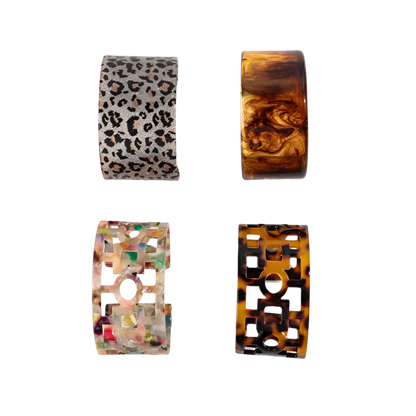 Bold leopard print wide cuff bangle featuring hollow geometric patterns and premium resin design for resort wear and theme nights

