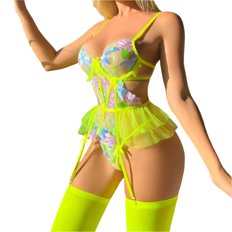 Person wearing a colorful, sheer outfit with neon green accents outdoors.