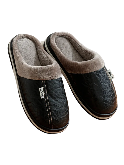 Pair of black and gray slippers on a wooden surface with a blurred background