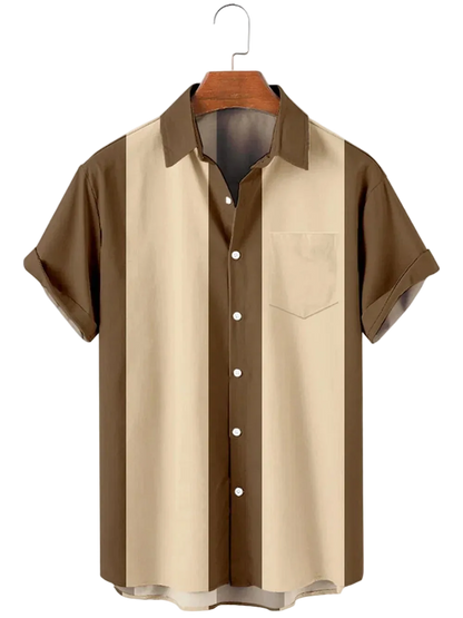 Two-tone brown and beige shirt on a hanger against a white background