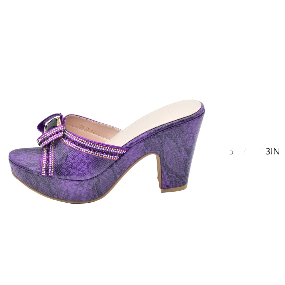 Purple high-heeled shoe with a measurement label on a white background