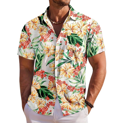 Man wearing a colorful floral short-sleeve shirt on a white background