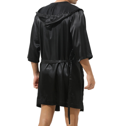 Black raincoat with a hood on a white background