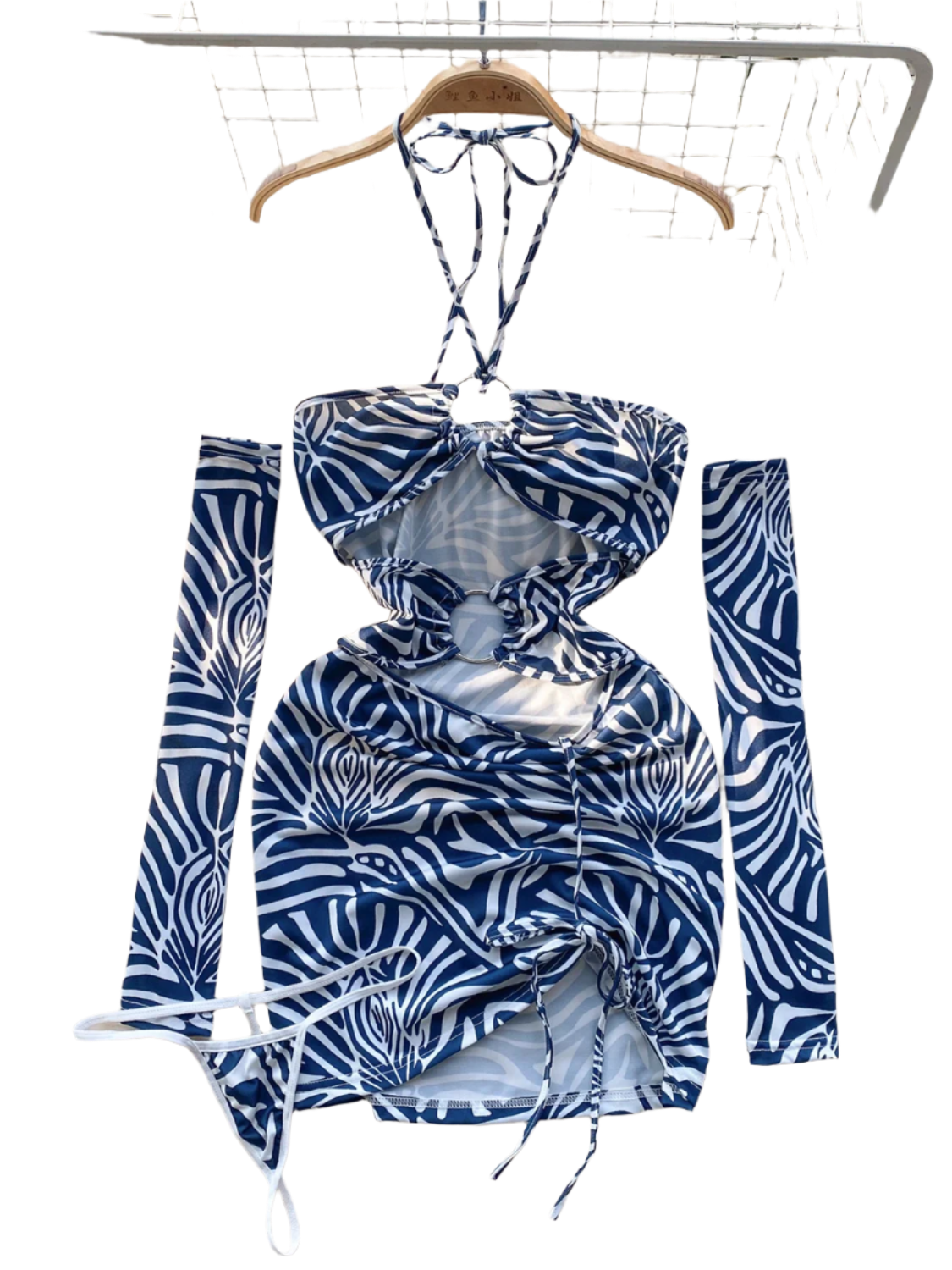 A zebra print dress with cut-out sections and ruching. It features a halter neck and matching arm sleeves, creating a wild and daring style.