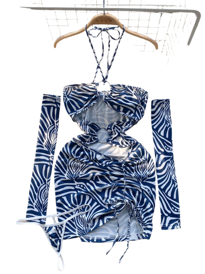 A zebra print dress with cut-out sections and ruching. It features a halter neck and matching arm sleeves, creating a wild and daring style.