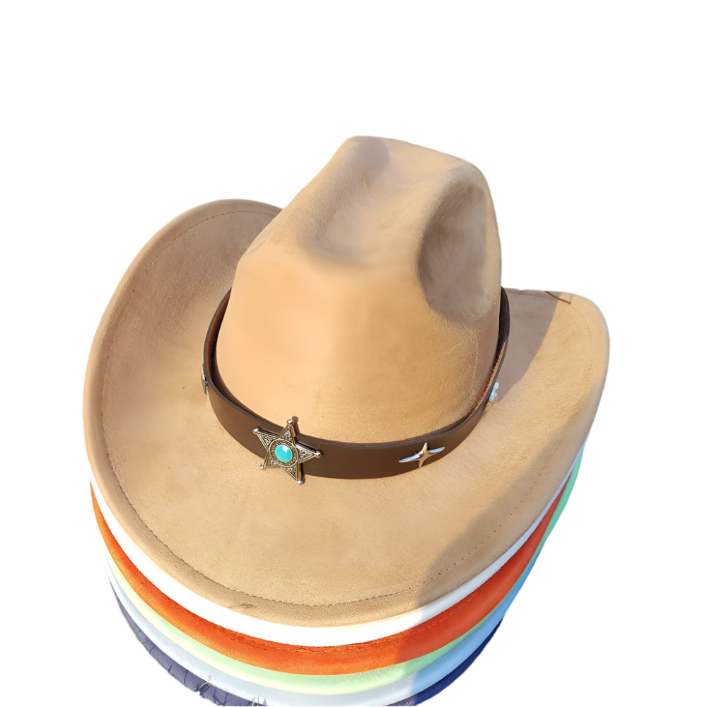 Brown cowboy hat with a star and turquoise stone on a stack of colorful hats on grass