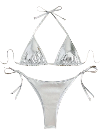 A shiny, iridescent bikini in shades of silver. It features a classic triangle top and tie-side bottoms, creating a vibrant and eye-catching beachwear style.