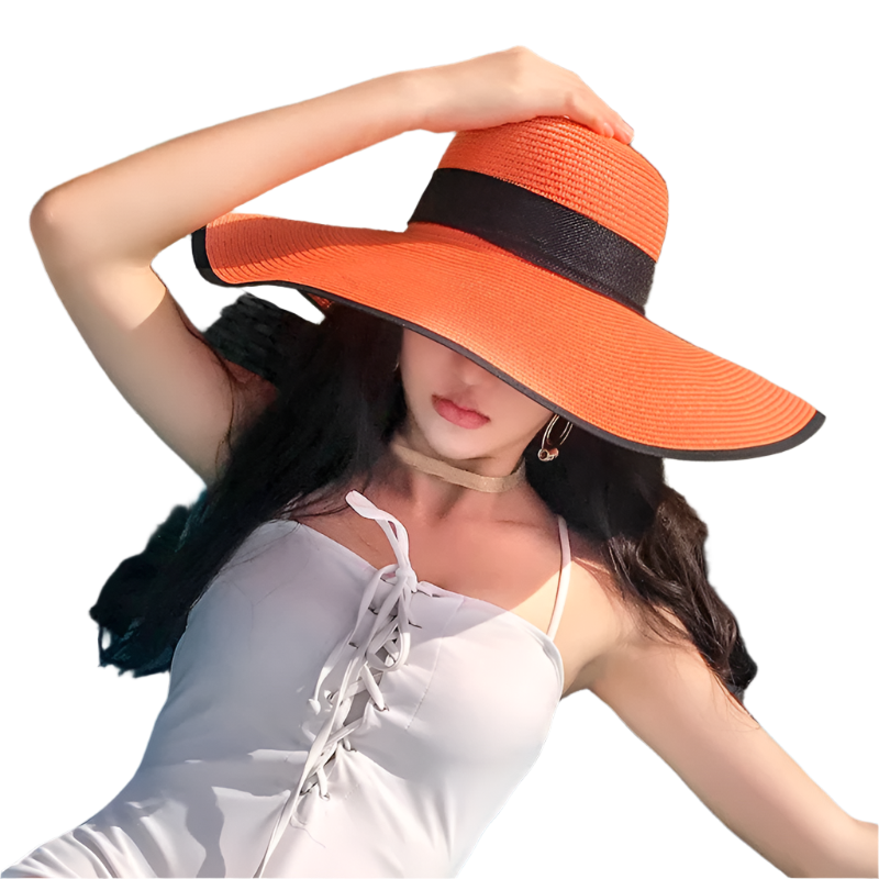 Woman wearing an orange hat with a black band, sitting on a chair outdoors.