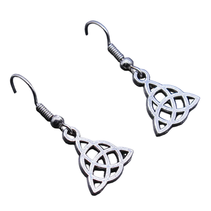 A pair of silver-toned Celtic triquetra dangle earrings with fishhook backings, displayed on a dark textured surface.