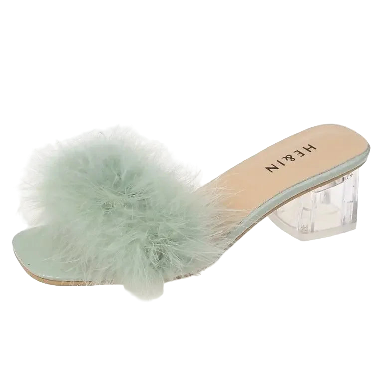 Mint green fluffy slide sandal with clear heel on a white background