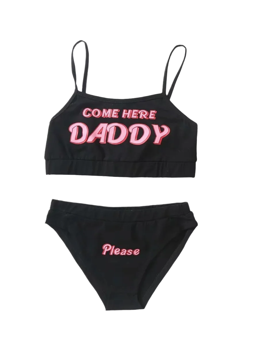 Loungewear Set: A black and white loungewear set with crop tops and matching bottoms. The tops have the text "COME HERE DADDY," and the bottoms say "Please," creating a playful and cheeky look.

