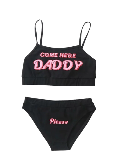 Loungewear Set: A black and white loungewear set with crop tops and matching bottoms. The tops have the text "COME HERE DADDY," and the bottoms say "Please," creating a playful and cheeky look.

