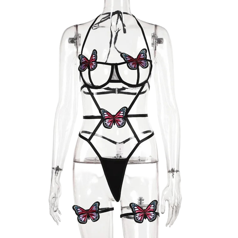 Translucent swimsuit with butterfly designs on a mannequin against a white background