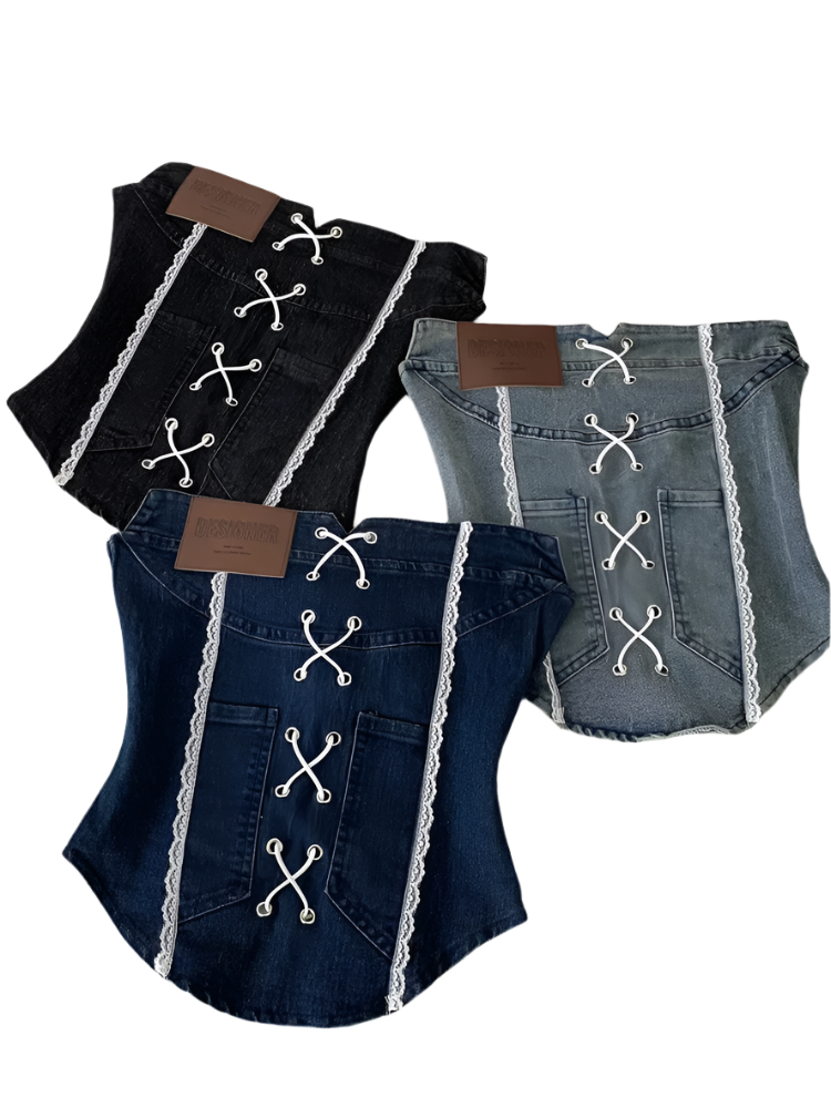 Denim dog outfit with lace details on a white surface