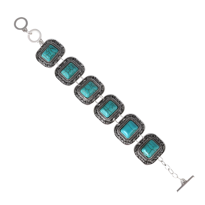 Bracelet with turquoise stones and silver accents on a white background