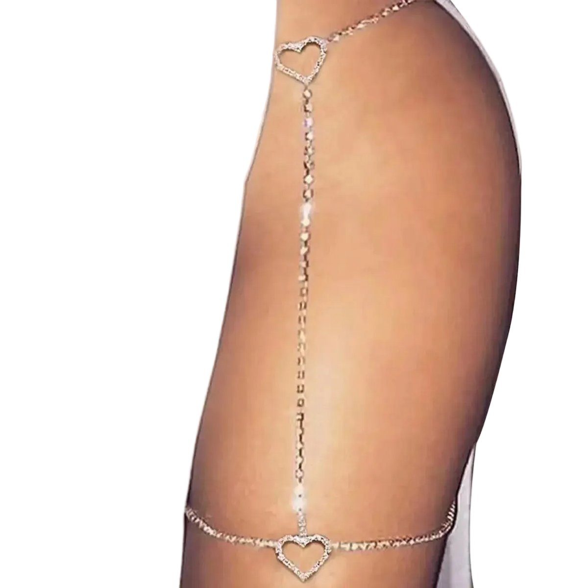 A close-up of a model's upper thigh wearing a delicate silver chain garter-style accessory with two heart-shaped links, one near the hip and one on the upper thigh.