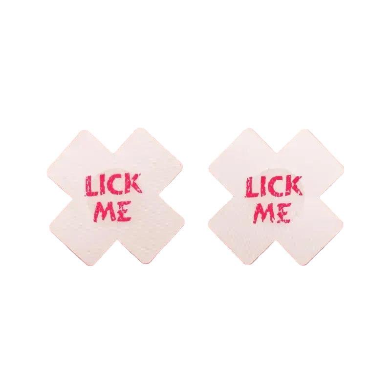 Two white diamond-shaped coasters with 'LICK ME' text on a pink background