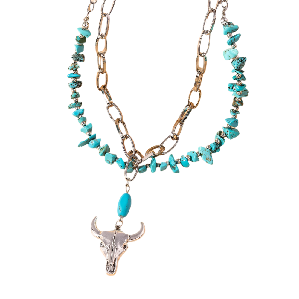Necklace with turquoise beads and a bull head pendant on a beige background