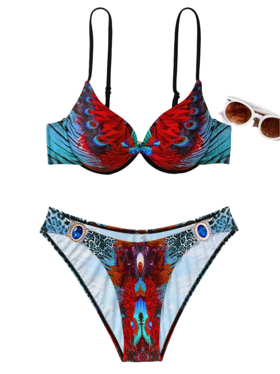 A bikini with a vibrant peacock feather print and jewel embellishments. The design is exotic and eye-catching, perfect for a bold beach look.