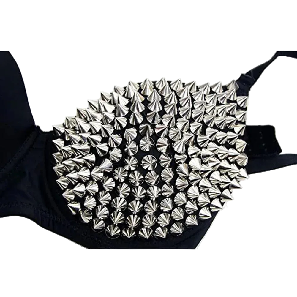 A close-up of a black bra cup heavily decorated with metallic silver conical spikes, shown against a plain white background.