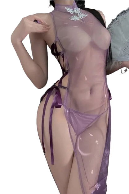 Person wearing a sheer purple lingerie set with floral details.