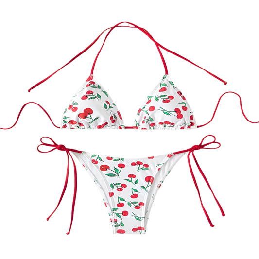 A white bikini with a cherry print. It features a classic triangle top and tie-side bottoms with red strings, giving it a playful and fruity look.
