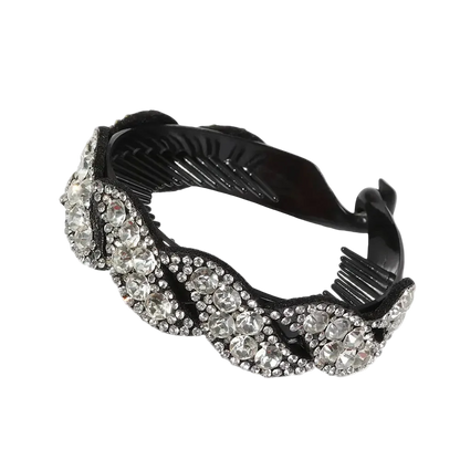 A black hair comb embellished with sparkling clear rhinestones in a wavy, layered design, shown on a plain white background.