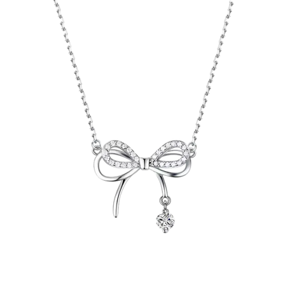 Silver bow-shaped necklace with a small pendant on a white background