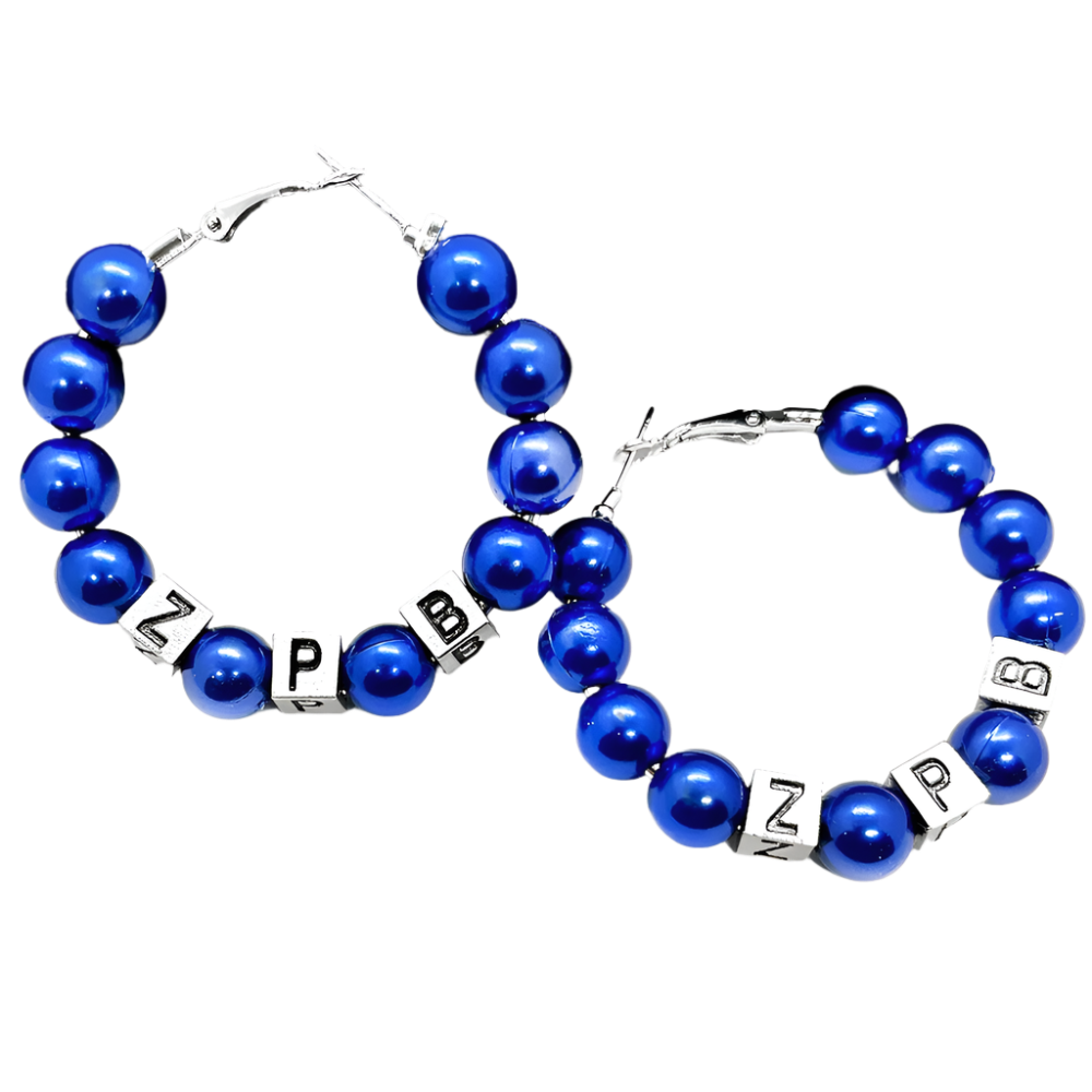 Blue beaded bracelets with letter charms on a black textured surface